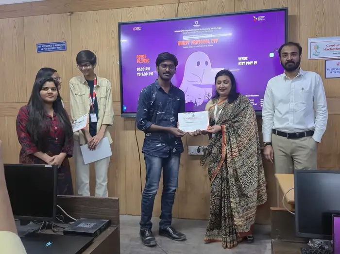 Team posing with certificates at the ceremony