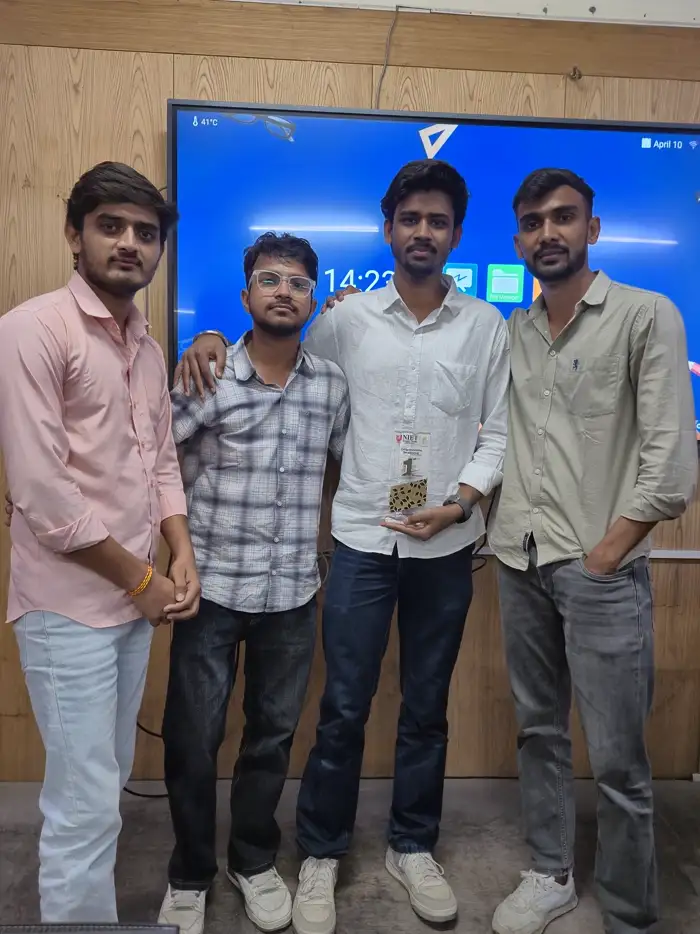 Three winners holding their certificates